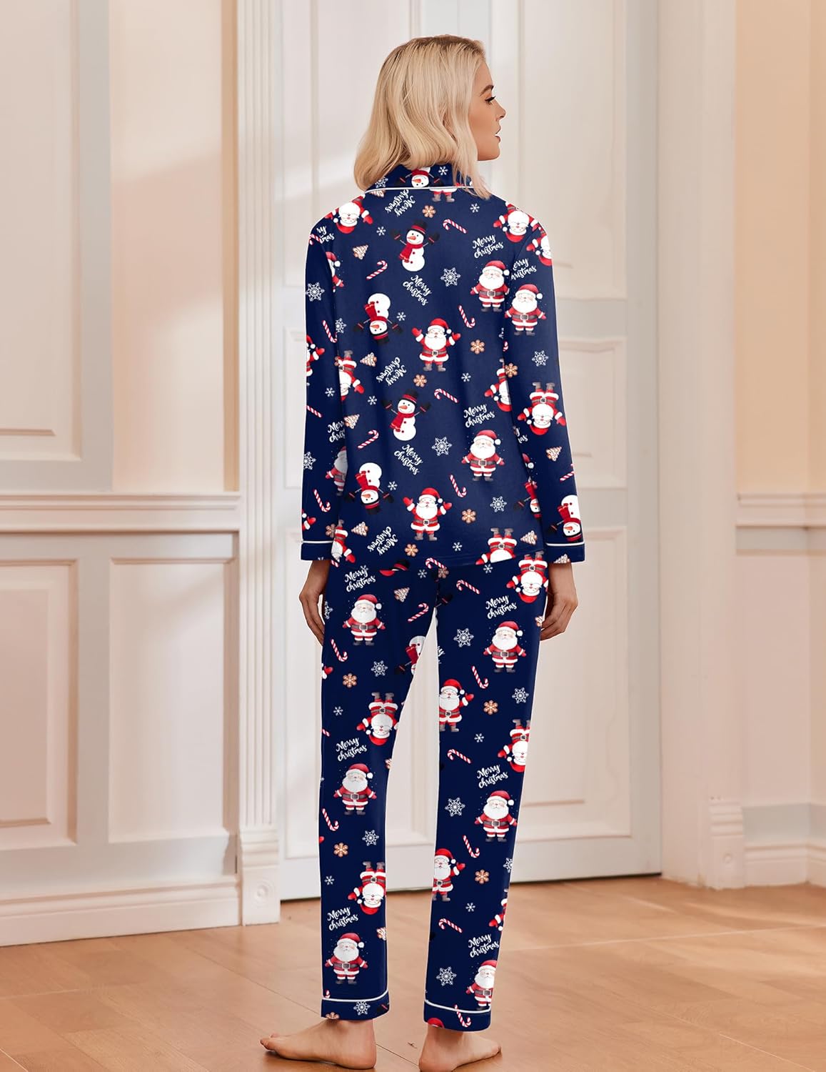 Navy Christmas pajama set, back view, long sleeves with snowman print on top and pants