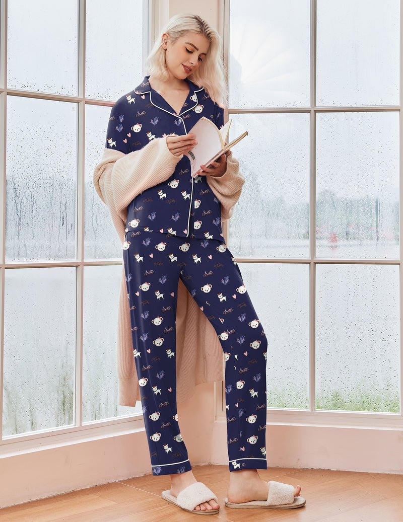 Navy long-sleeve Christmas pajama set with festive character print, button closure and pants