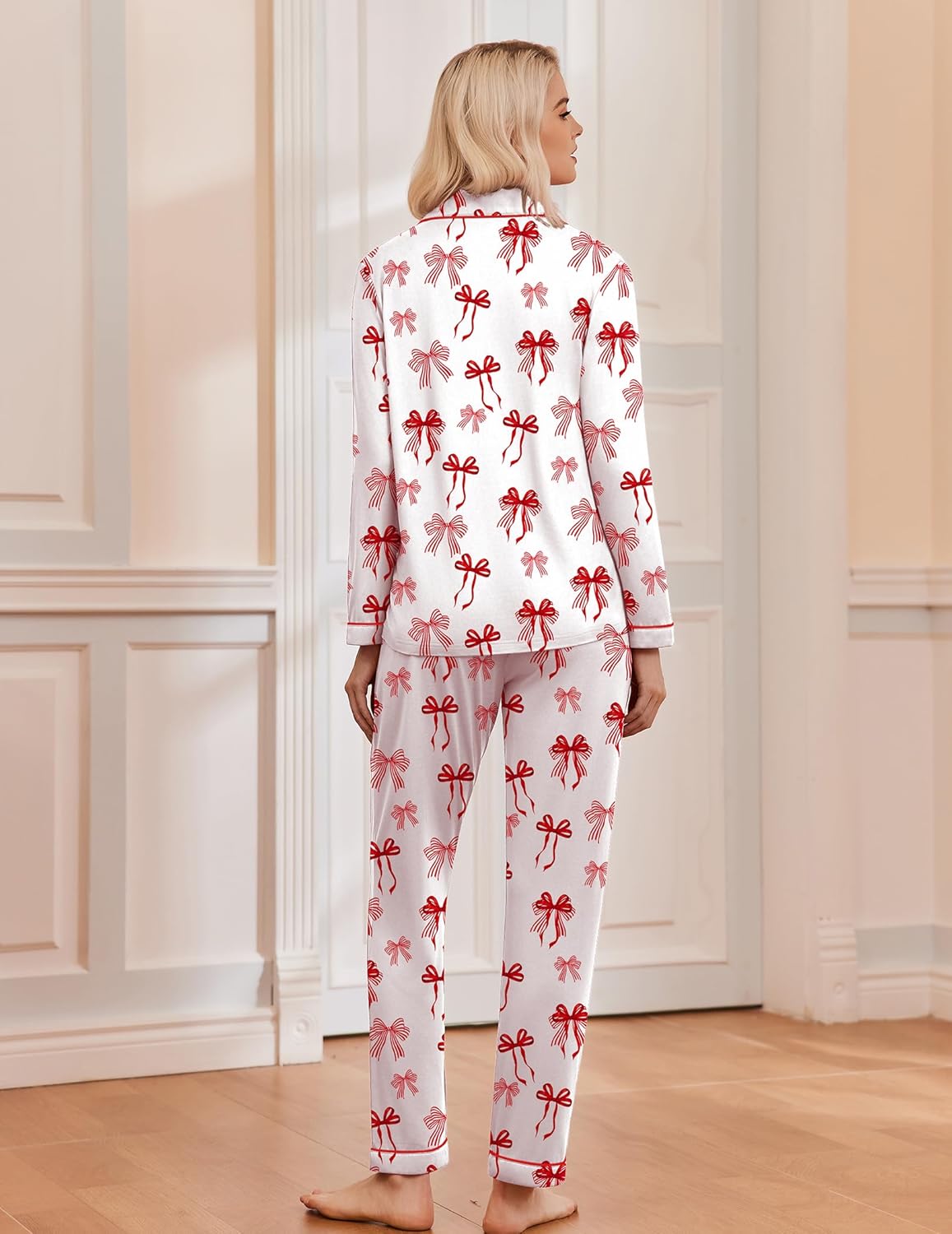 Back view: white Christmas pajama set with red bow print on long sleeves and pants