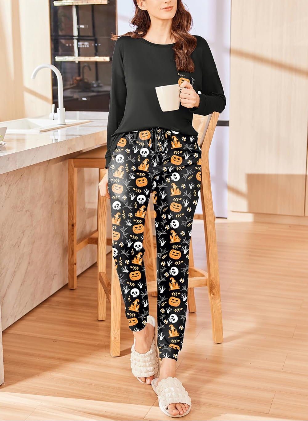 Halloween-style PJ set: black long-sleeve top with cartoon pumpkin printed pants