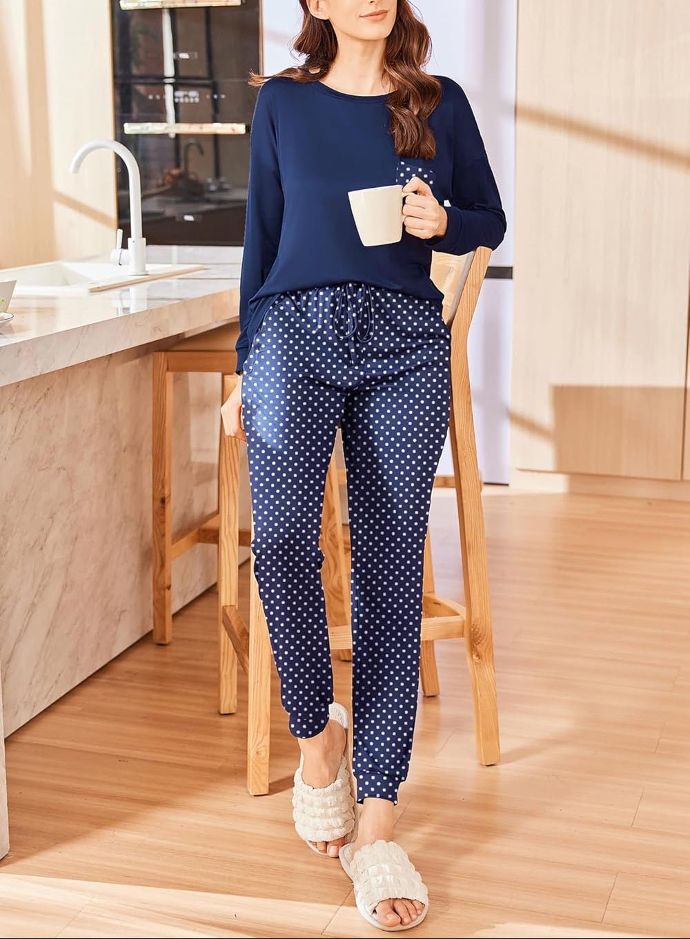 Christmas PJ set with navy long-sleeve top and navy polka-dot pajama pants
