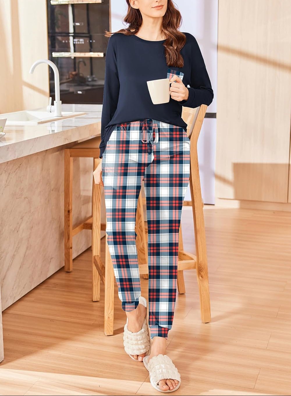 Christmas PJ set with navy long-sleeve top and red-blue plaid drawstring pants