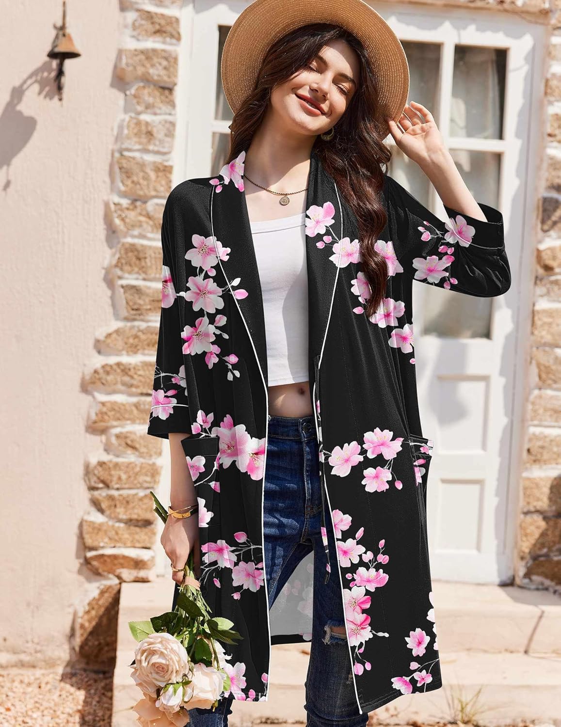 Black robe with pink flower print and contrast trim; tied waist detail