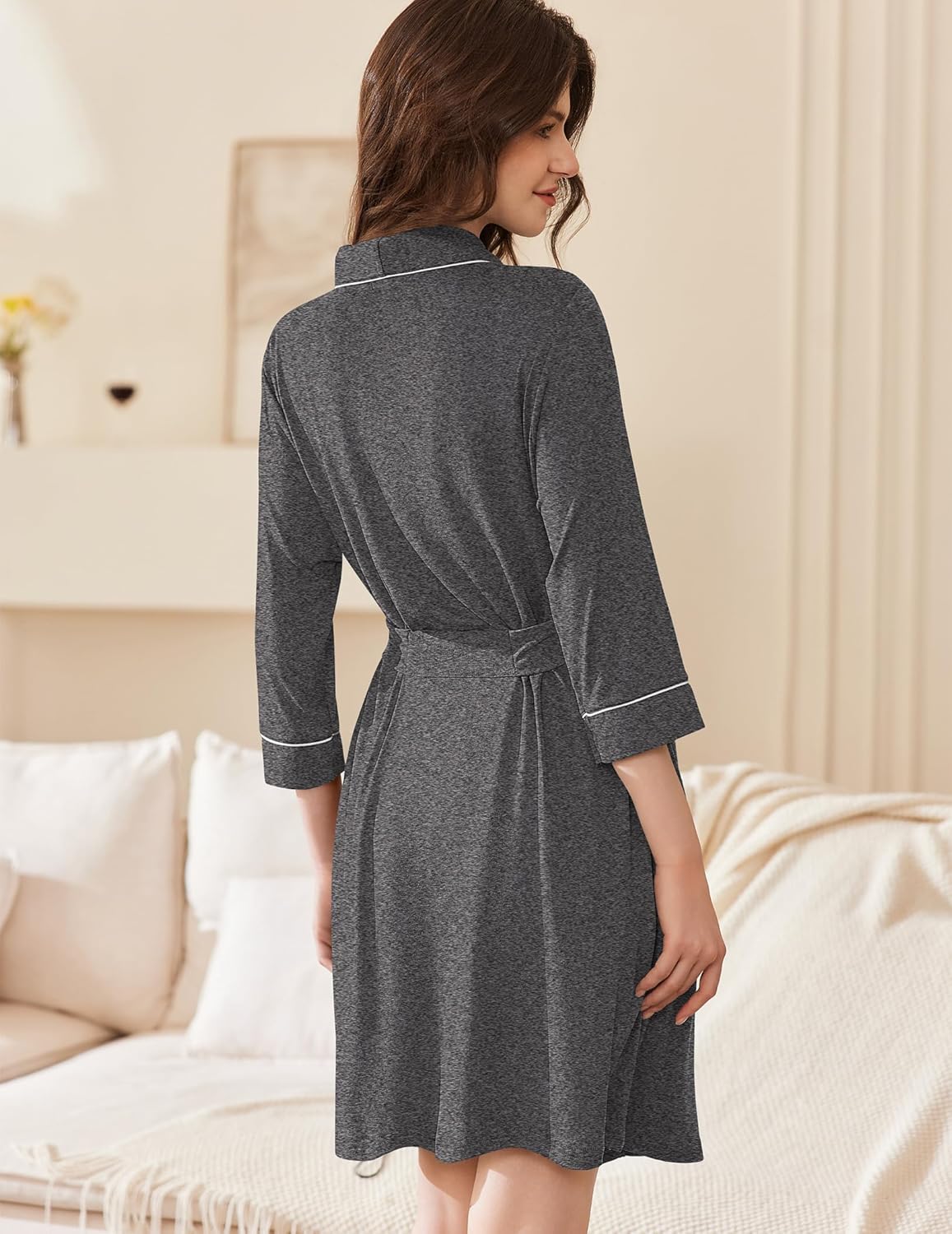 Back view dark gray short kimono robe with shawl collar, white piping, and tie belt