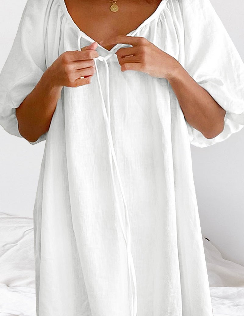 White cotton nightgown with tie-front neckline and gathered detail at yoke