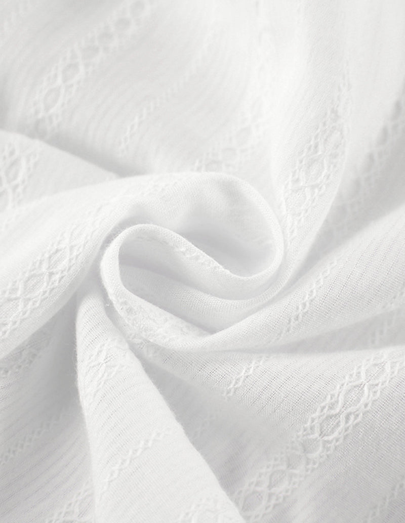White cotton jacquard fabric closeup with swirling texture