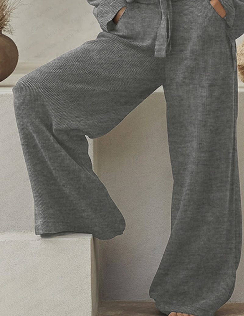 Grey knit wide-leg lounge pants with drawstring waistband, side view