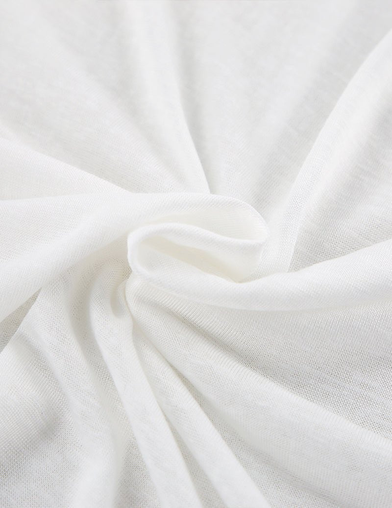 White knitted fabric detail with looped drawstring