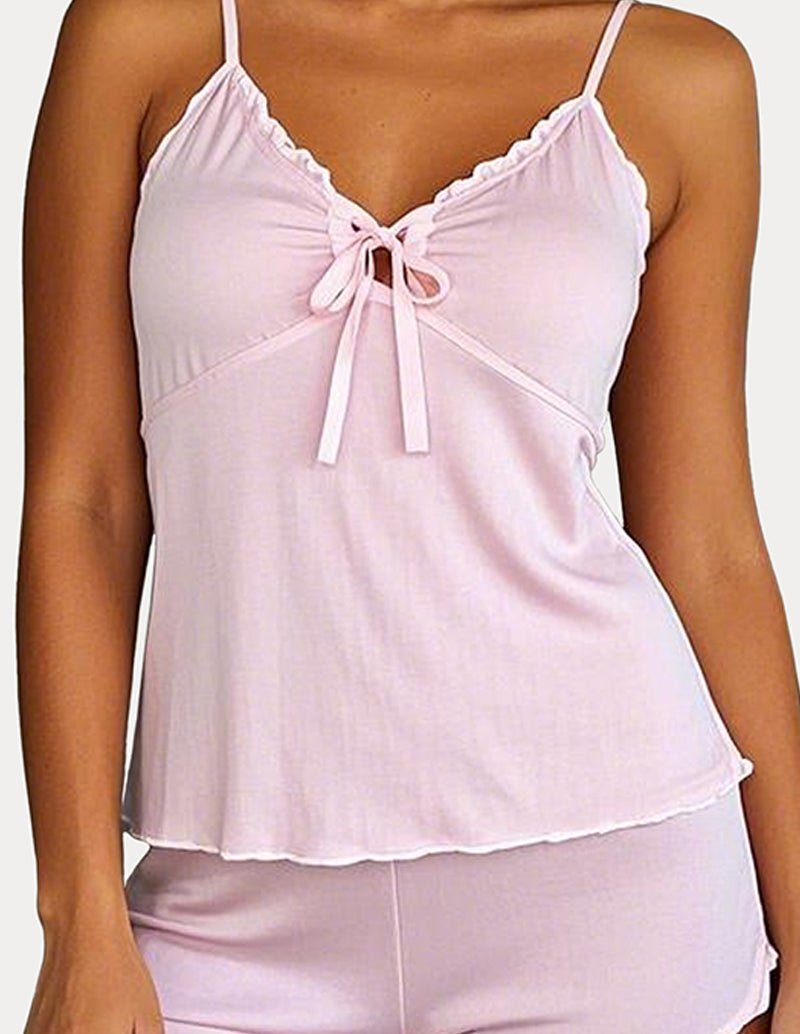 Pink cami pajama set with ruffle-trim cami top and bow tie neckline.