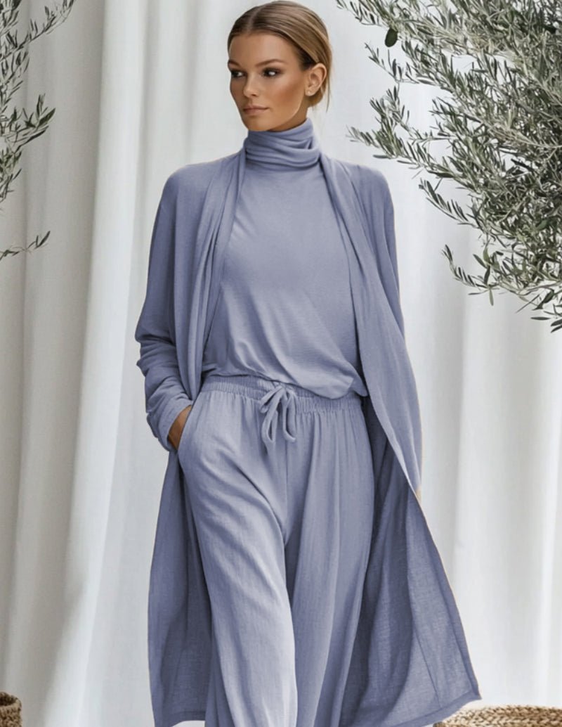 Blue cotton lounge set with mock-neck top, drawstring pants, and long cardigan