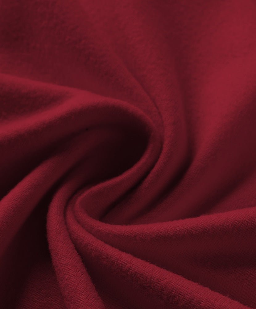 Wine red loungewear fabric close-up with smooth knit texture and soft drape
