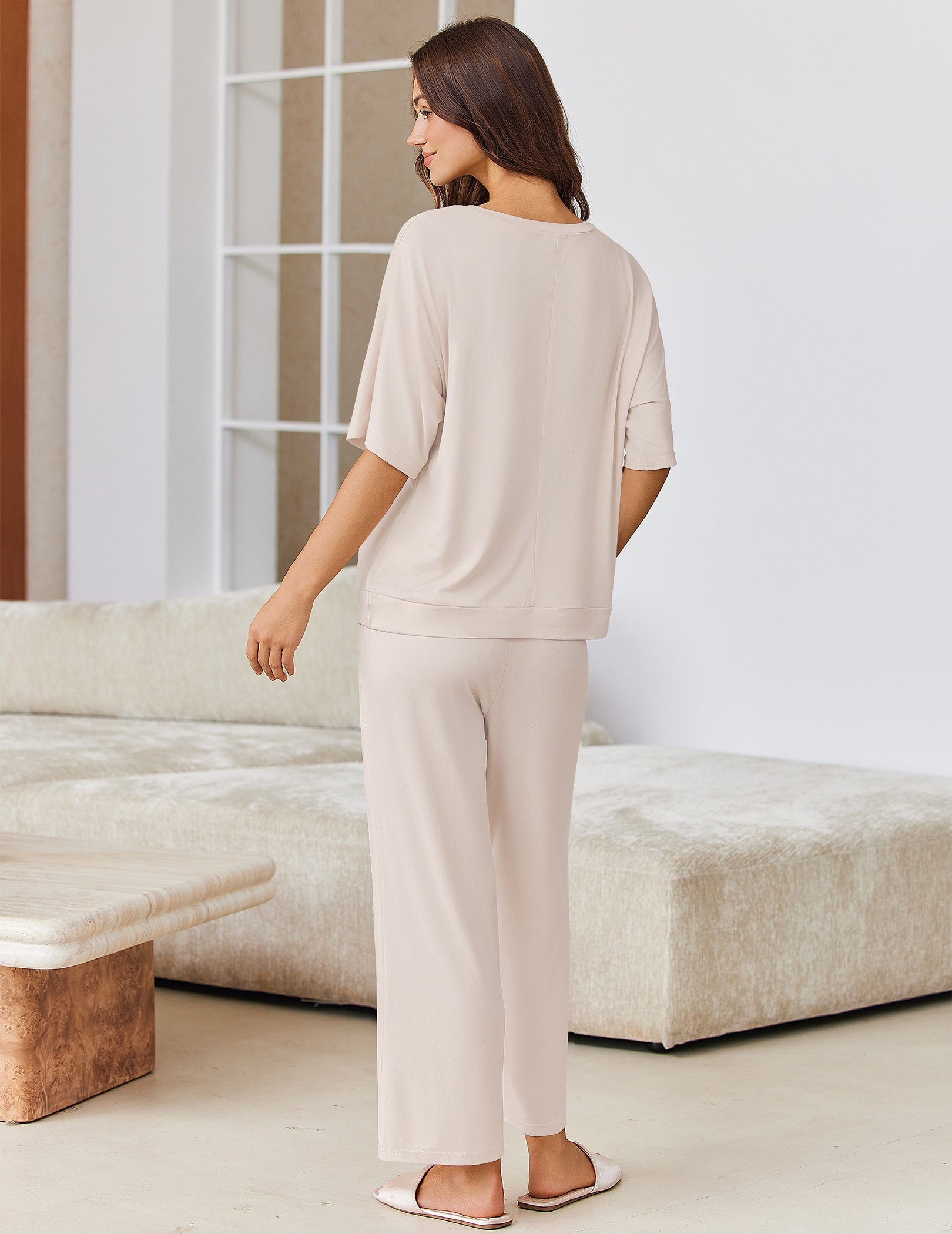 Cream pajama set: back view of short-sleeve top and wide-leg pants