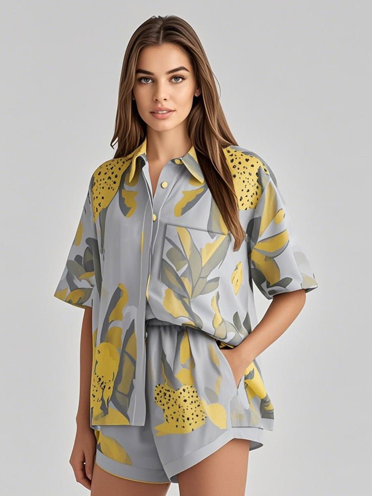 Gray leaf-print satin lounge set with short-sleeve shirt and matching shorts