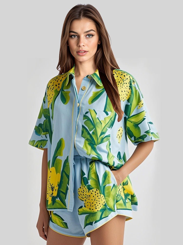 Green leaf-print satin lounge set with short-sleeve shirt and matching shorts