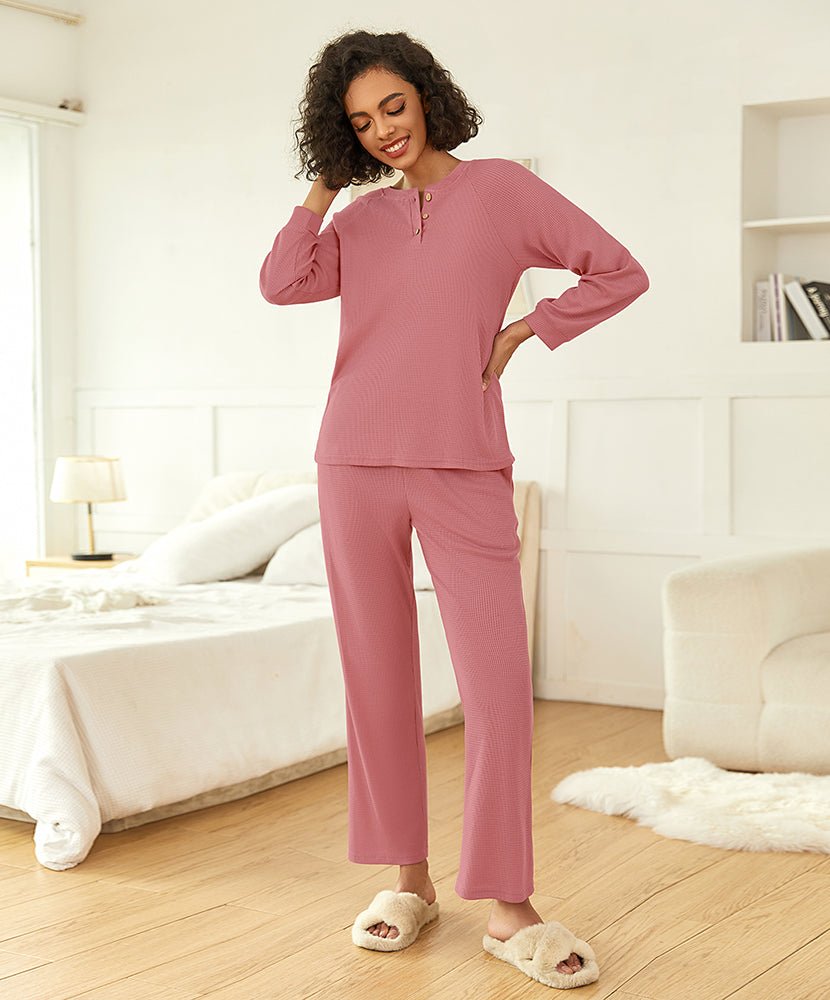 Pink waffle-knit pajama set with quarter-zip top and straight-leg pants