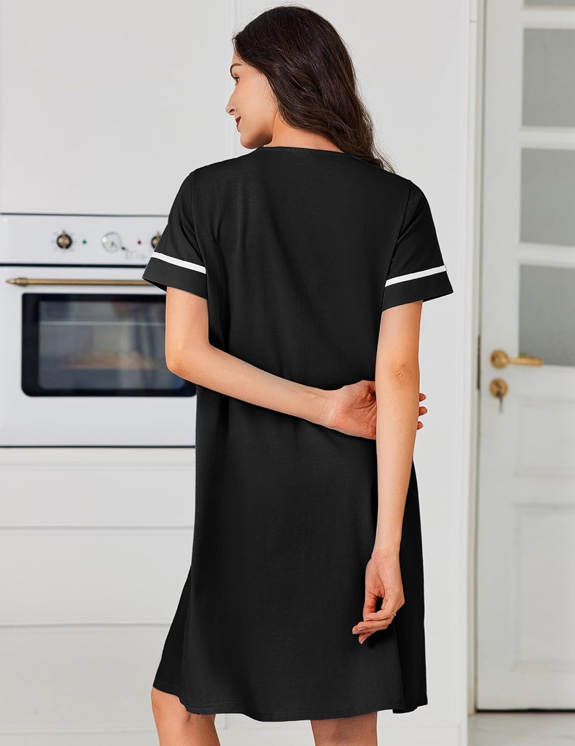 Cotton nightgown dress in black, back view, short sleeves, button-down front detail, pockets