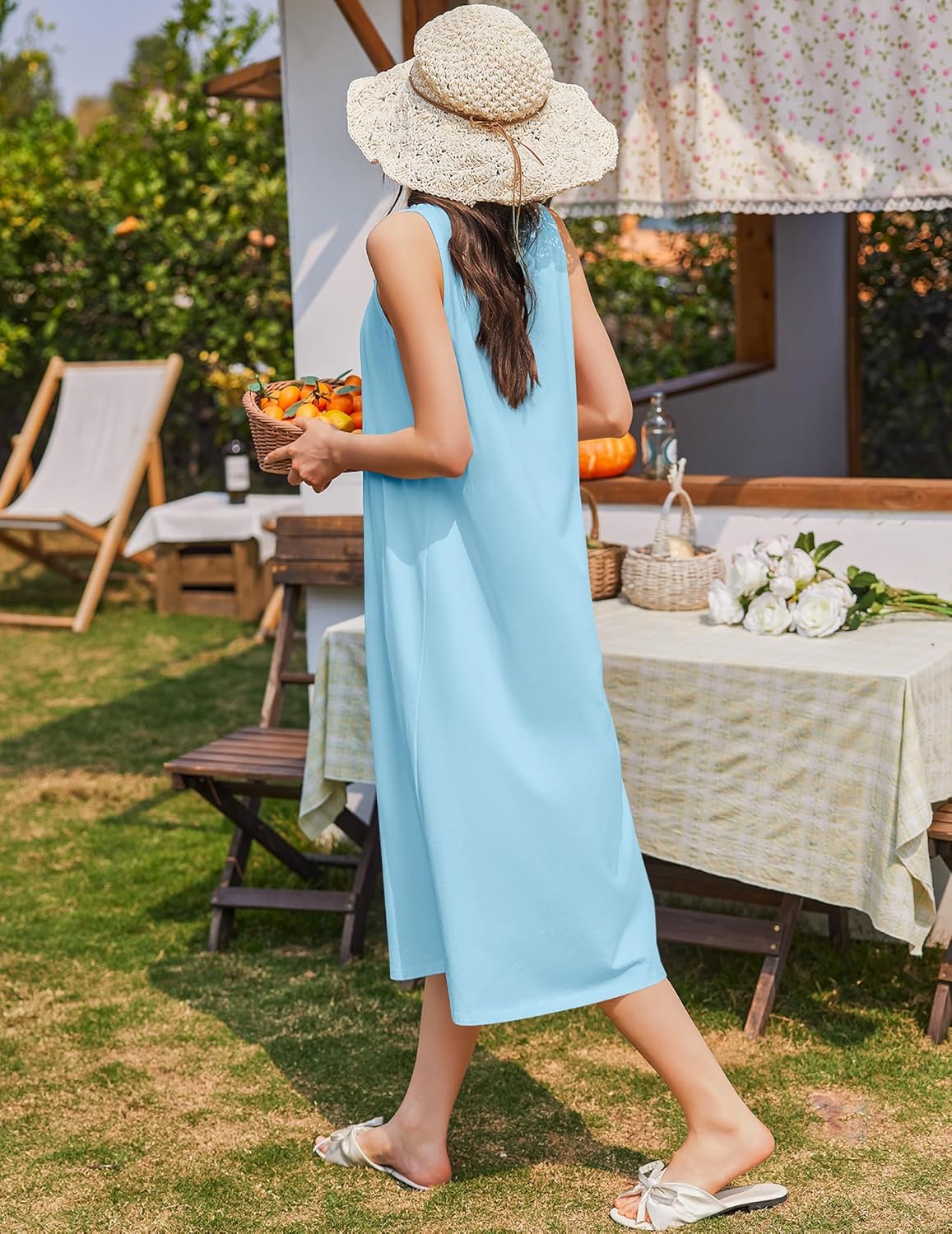Light blue sleeveless cotton nightgown with button details and gathered upper front