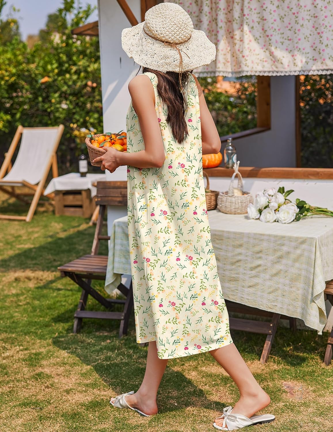 Pale yellow-green sleeveless nightgown with gathered yoke and floral leaf print