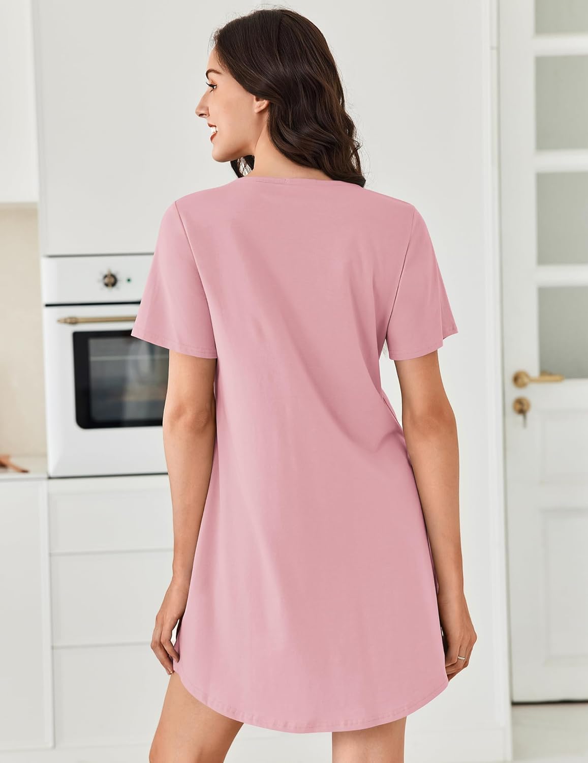 Back view of pink cotton nightgown, short sleeves and V-neck henley button placket