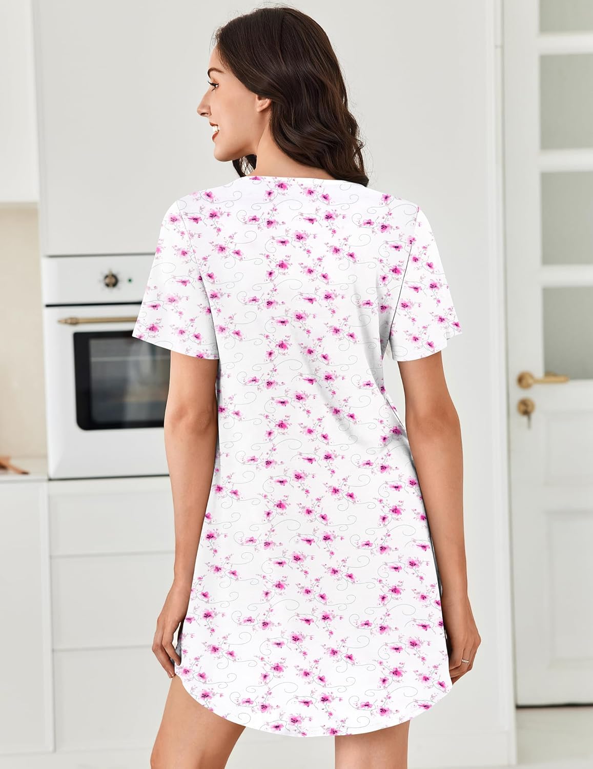 White nightgown with pink floral print, V-neck henley, back view
