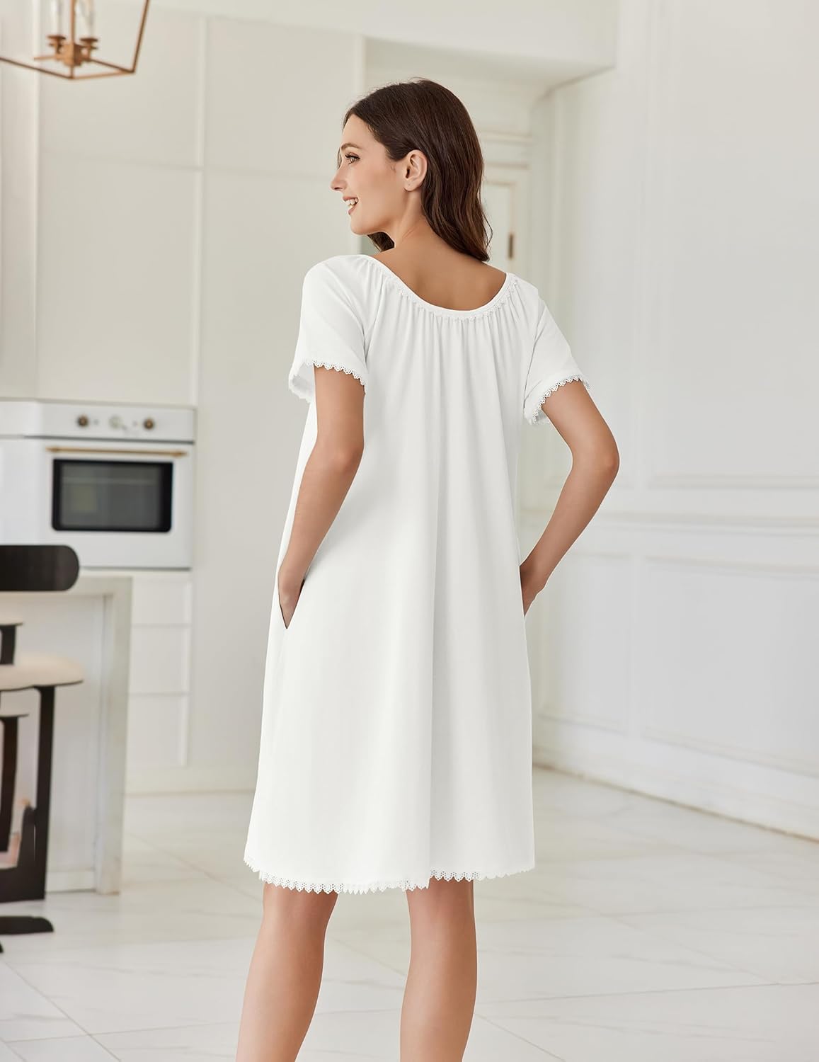 White cotton nightgown, back view, short sleeves with lace trim at hem