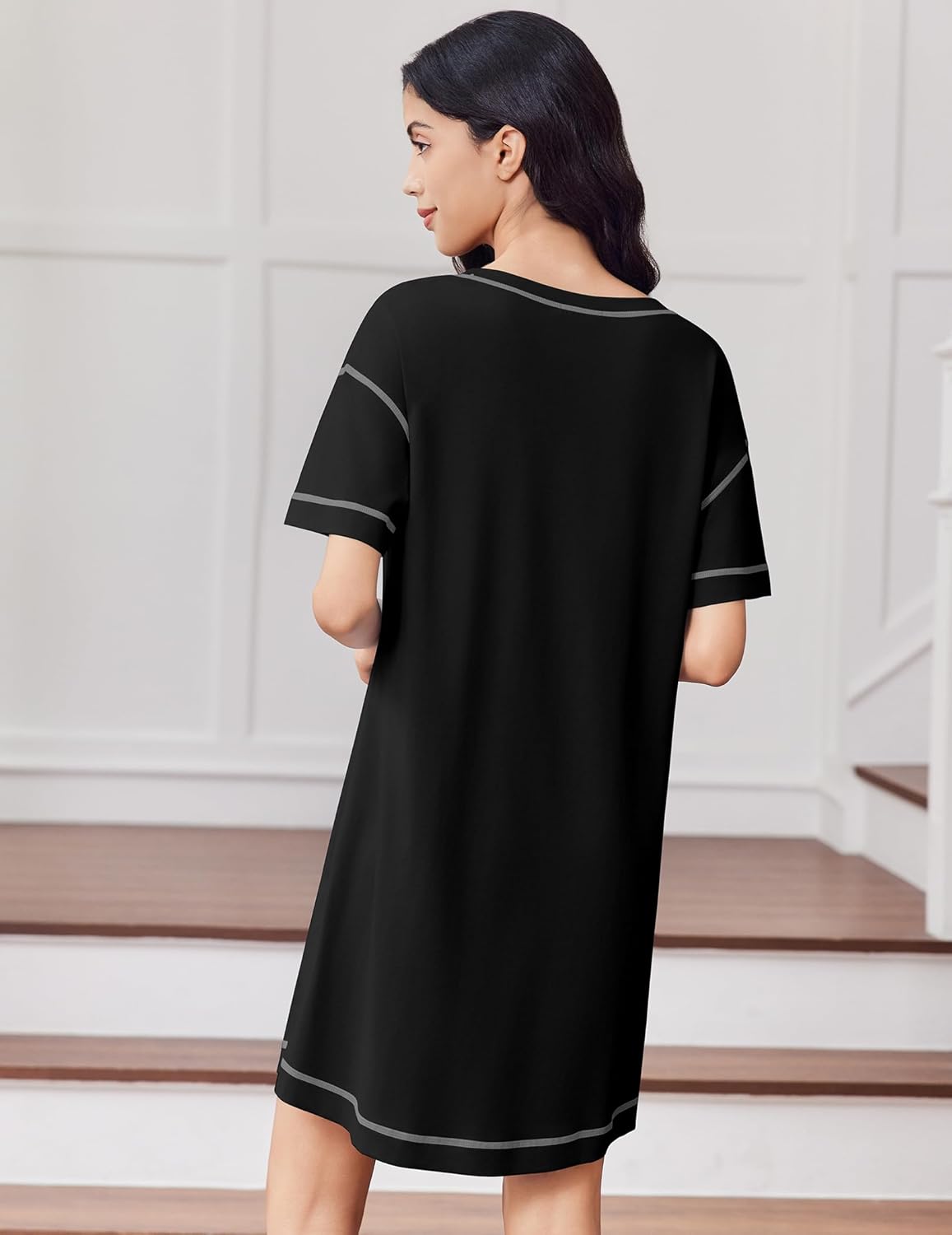 Black cotton nightgown, back view, short sleeves with white contrast trim