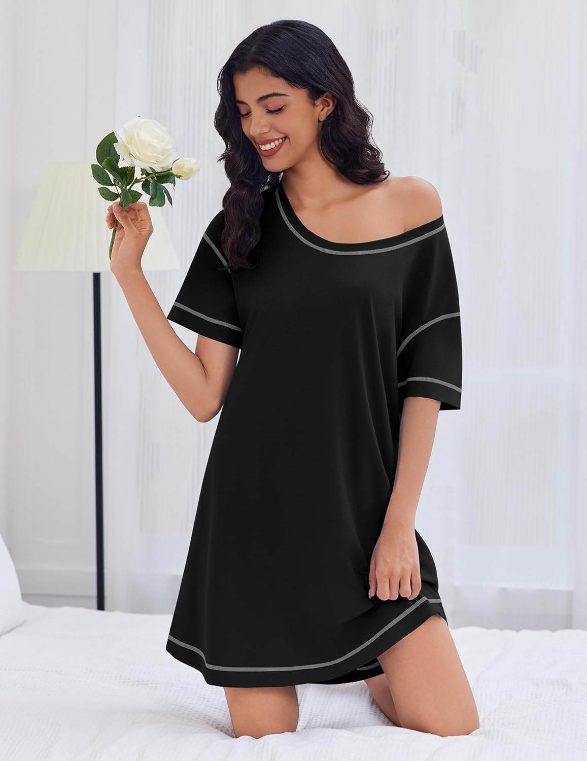Black cotton nightgown with wide neckline and 3/4-length short sleeves, white trim