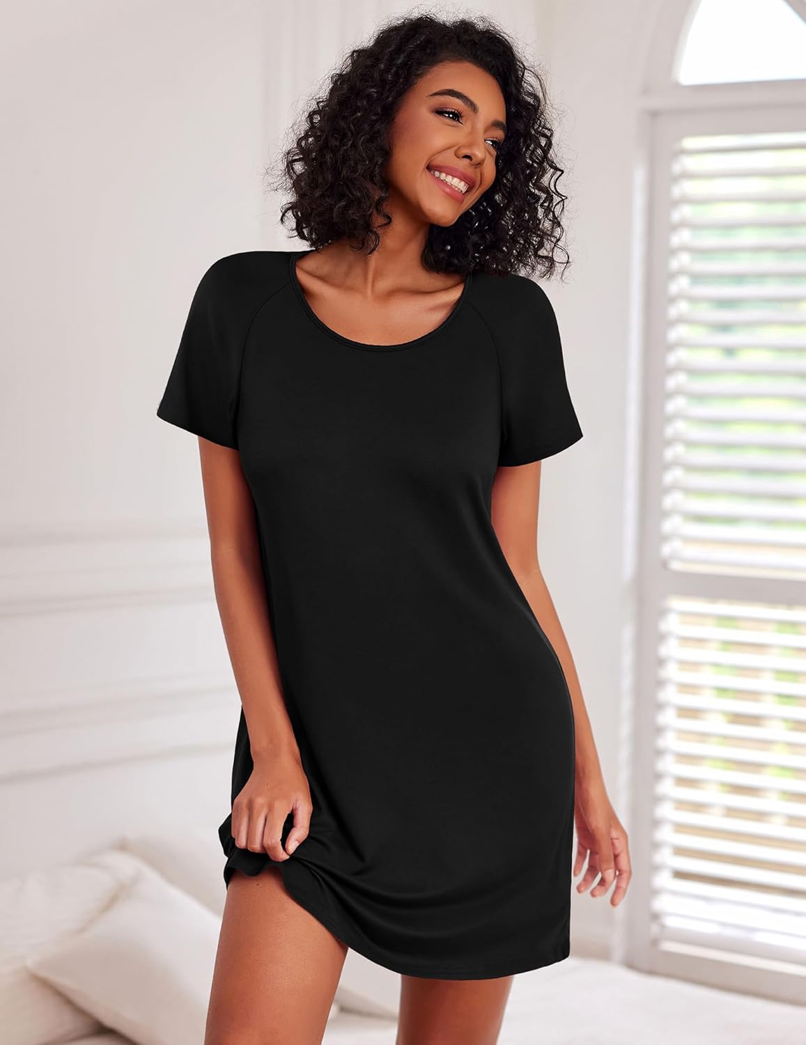 Black solid nightshirt dress with crew neckline and short sleeves, relaxed mini fit