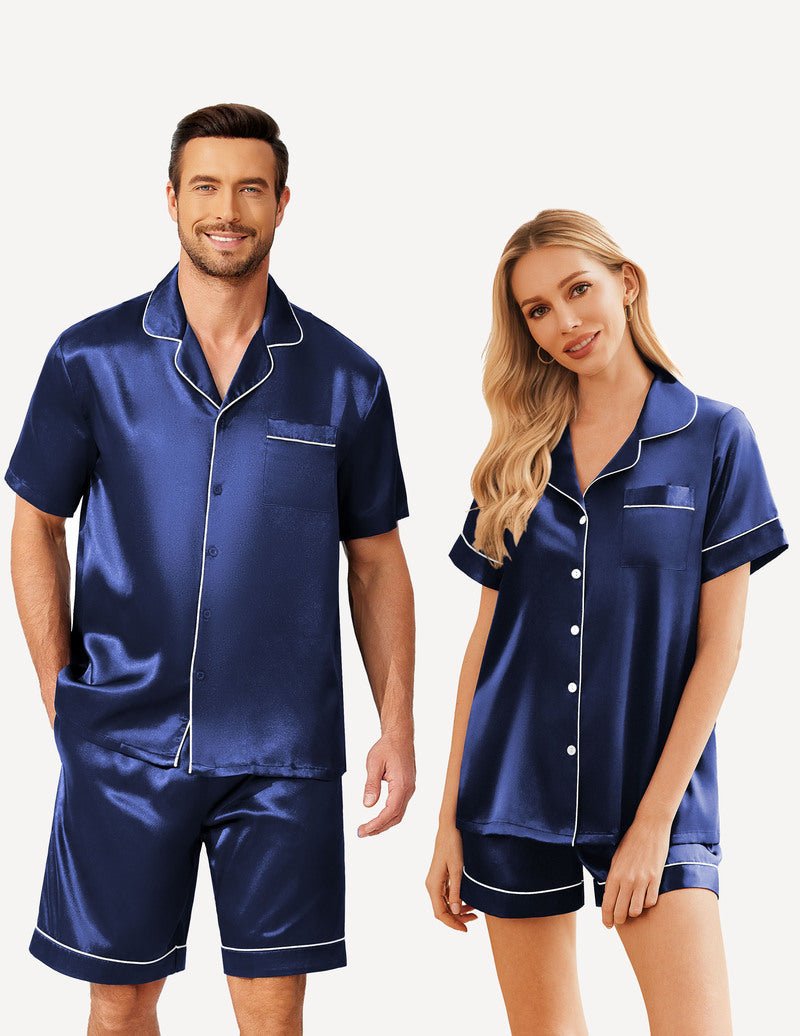 Navy satin pajama set for couples: short-sleeve button shirt and matching shorts with light trim.