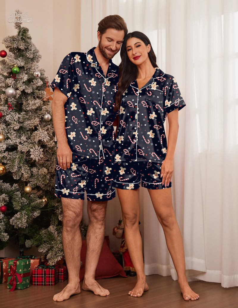 Navy Christmas pajama set with gingerbread patterns; short-sleeve button shirts and shorts.