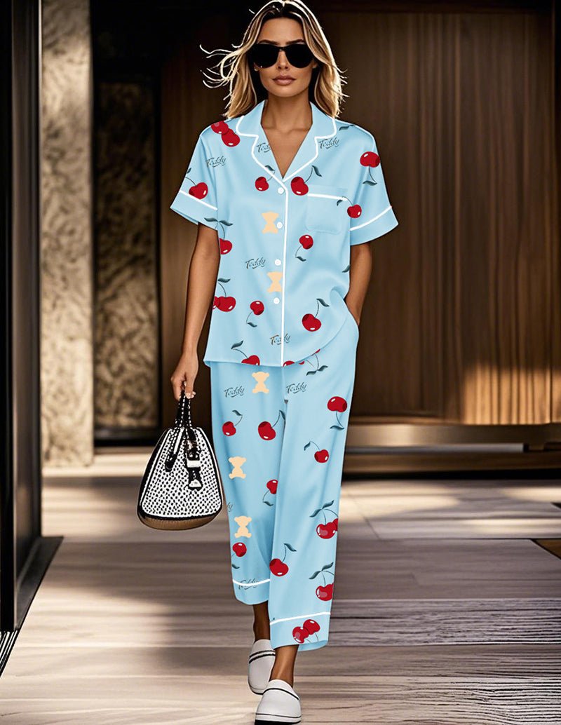 Blue cherry satin pajama set with short-sleeve button top and matching cropped pants