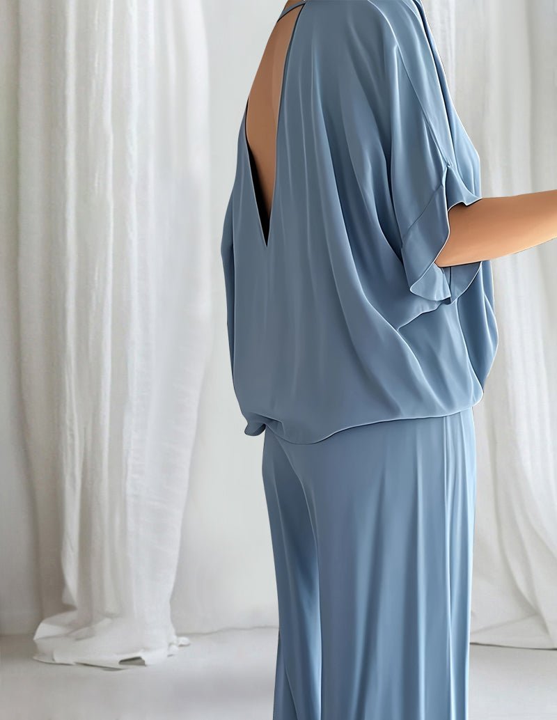 Blue lounge set with V-neck dolman top and drawstring wide-leg pants, side view