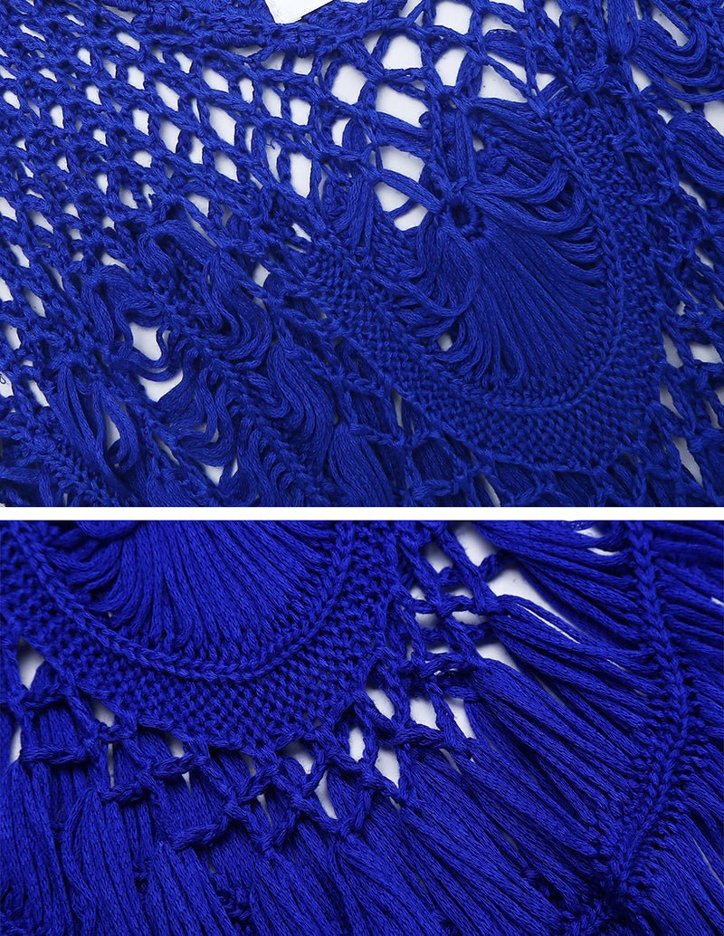 Blue crochet fabric close-up with openwork lattice and dangling fringe threads