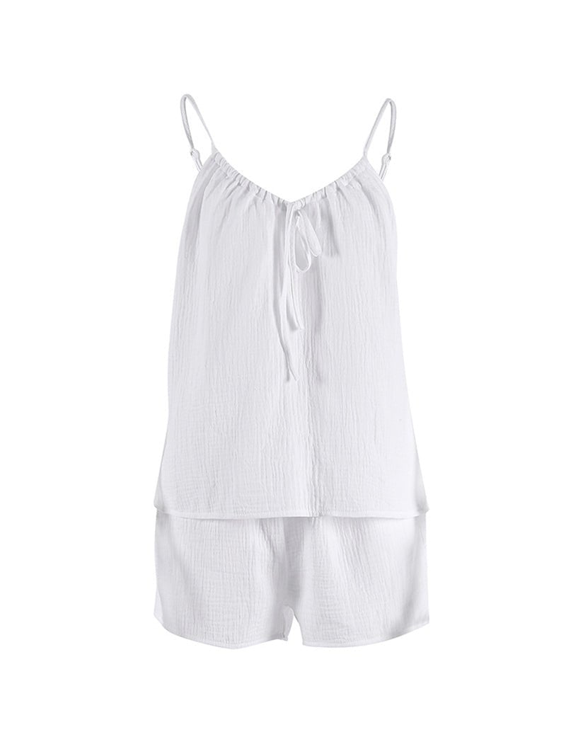 White cotton pajama set, cami top and matching shorts, laid flat