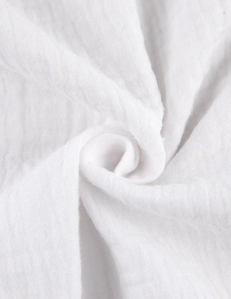 White 100% cotton pajama set fabric close-up
