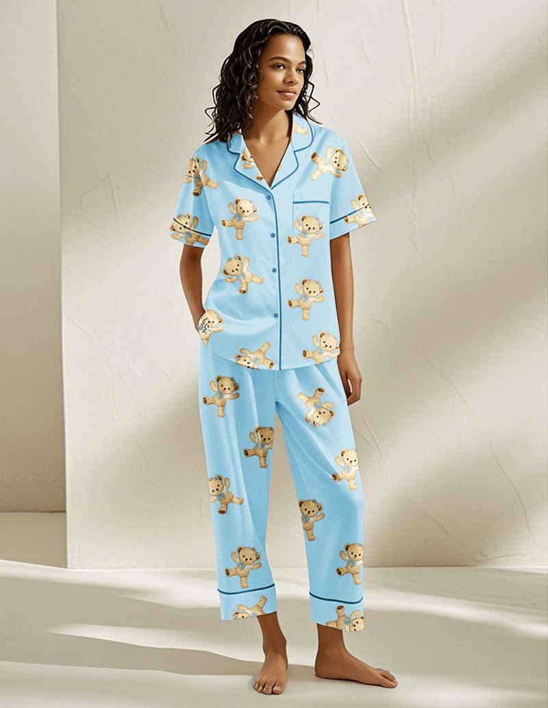 Blue teddy bear pajama set with button-front shirt and matching pants, all-over bear print