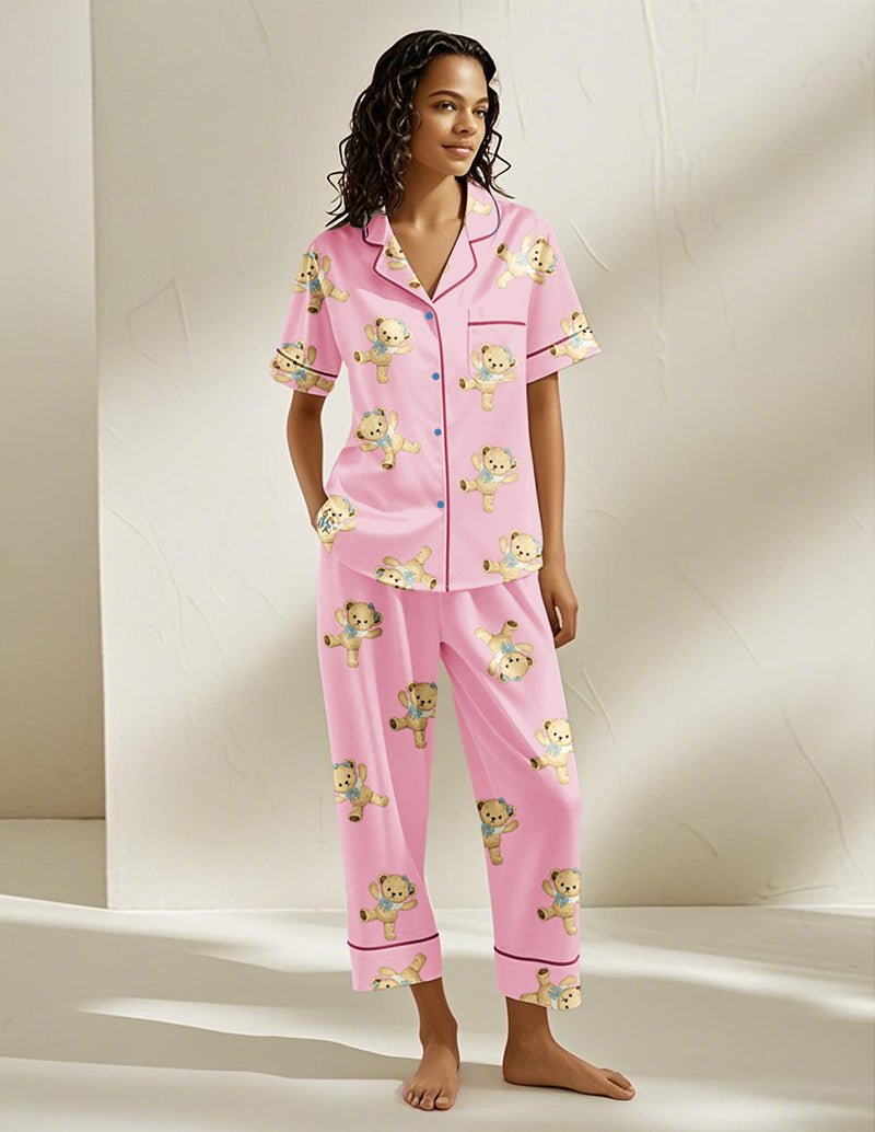 Pink teddy bear pajama set with button-front shirt and matching pants, all-over bear print
