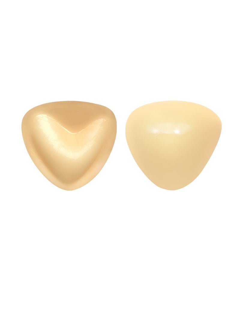 Self-adhesive chest pad pair, glossy pale beige triangular cups.