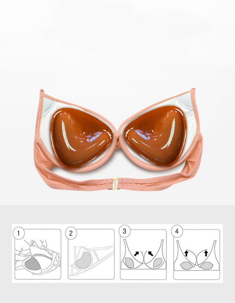 Self-adhesive chest pad pair placed in a pink bra top.