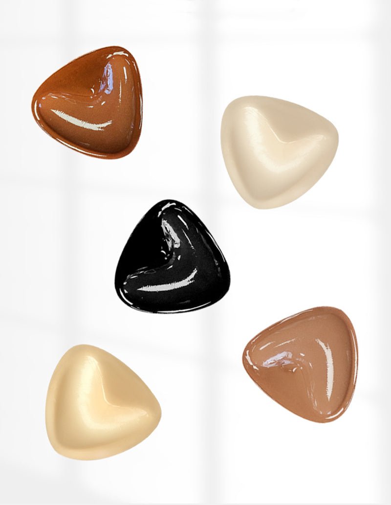 Self-adhesive chest pad set with black, beige, caramel, apricot, and brown pads.