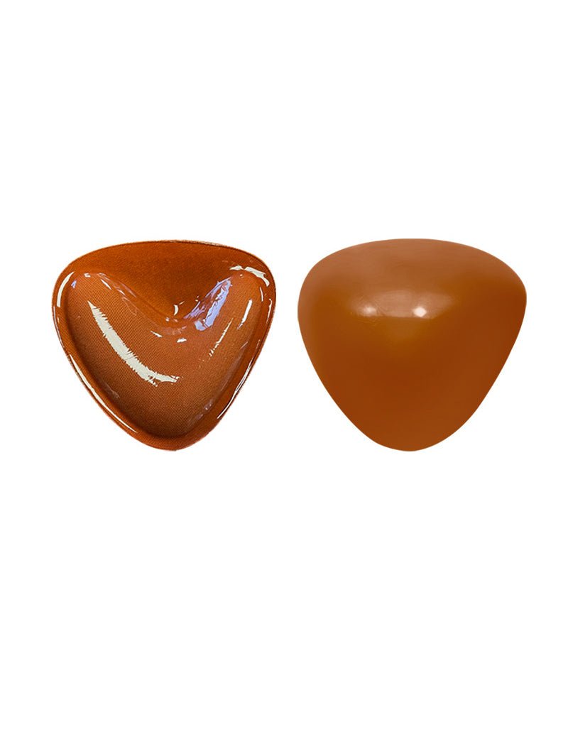 Self-adhesive chest pad pair, glossy caramel brown and brown triangular cups.