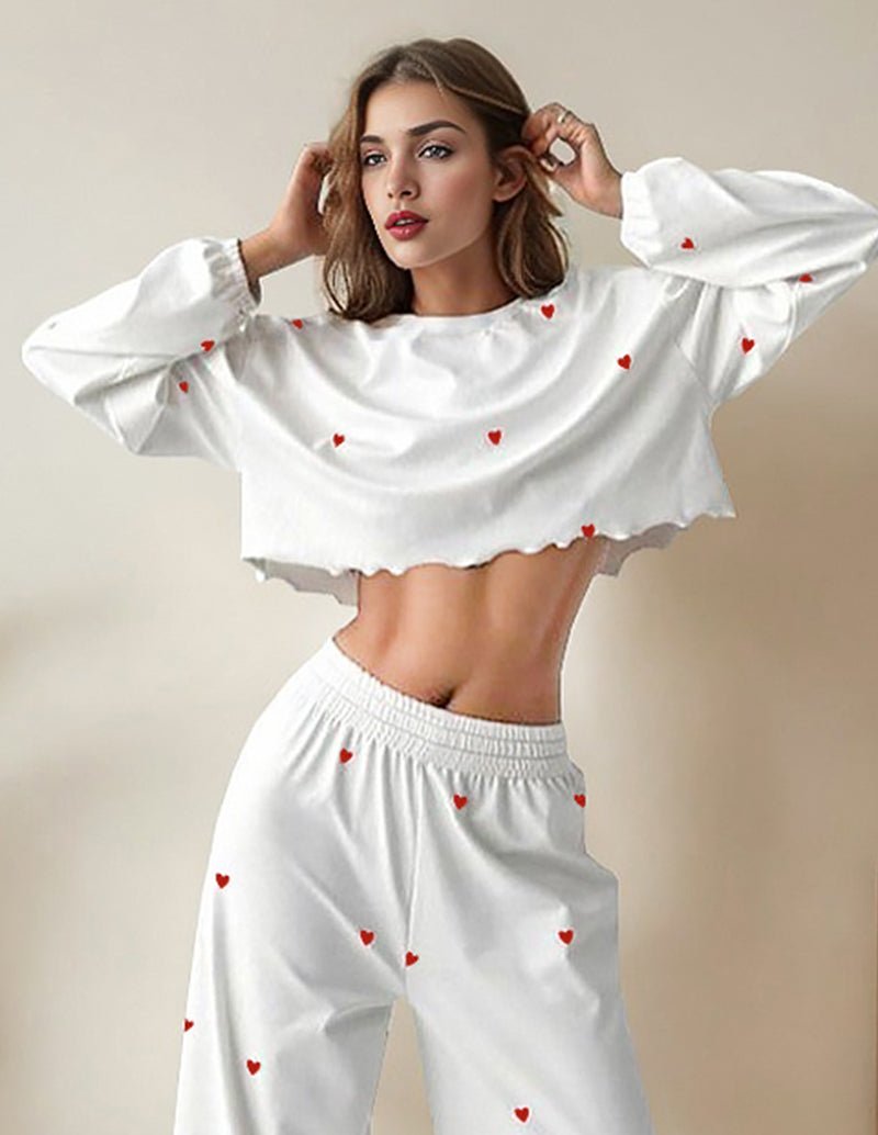 White ruffled lounge set with red heart print, cropped top and high-waist wide pants.