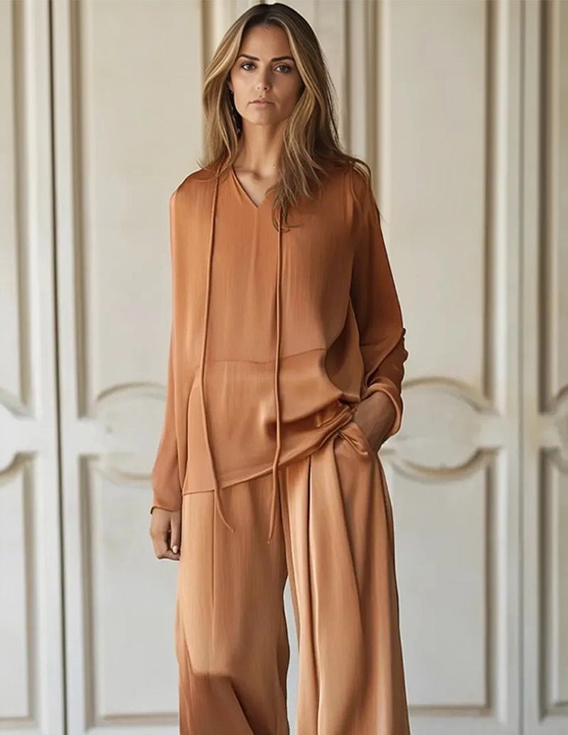 Brown lounge set with V-neck top, layered drape hem, and wide-leg pants