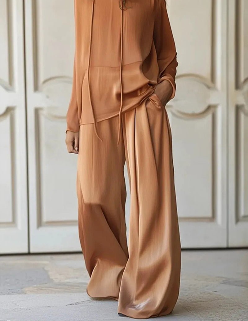 Brown lounge set with long sleeves, side-ruched detail, and wide-leg trousers