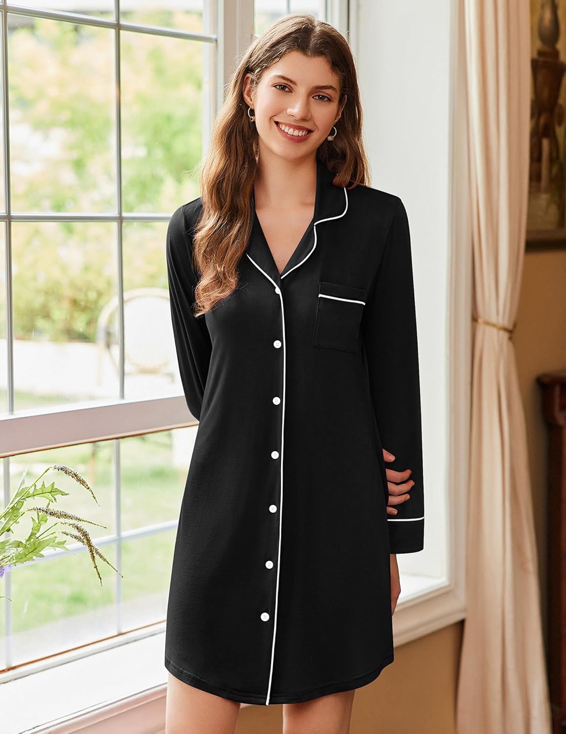 Long-sleeve sleep dress in black with button front, contrast white trim, and chest pocket