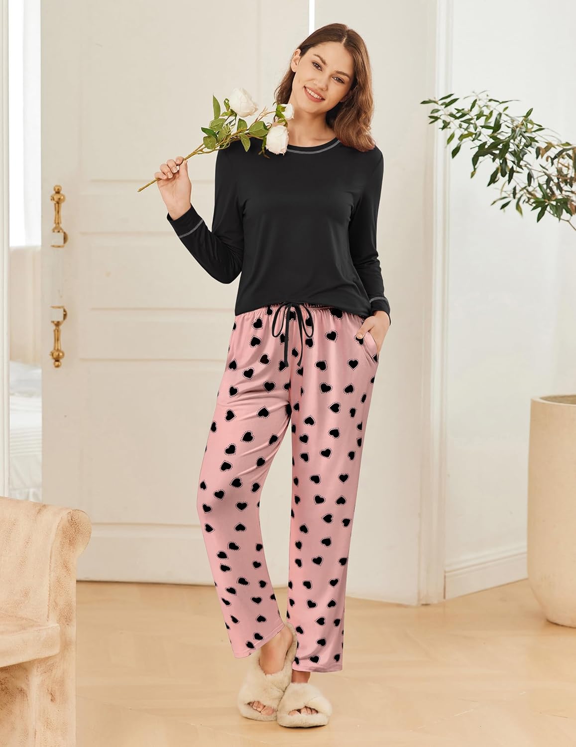 Black long-sleeve pajama set with pink heart print pull-on pants