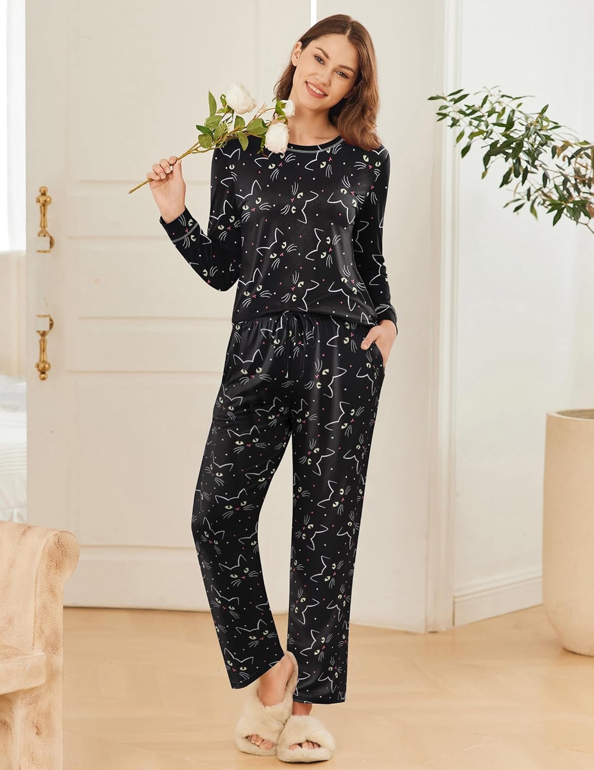 Long-sleeve pajama set: black top with cat print and matching black cat-pattern pants