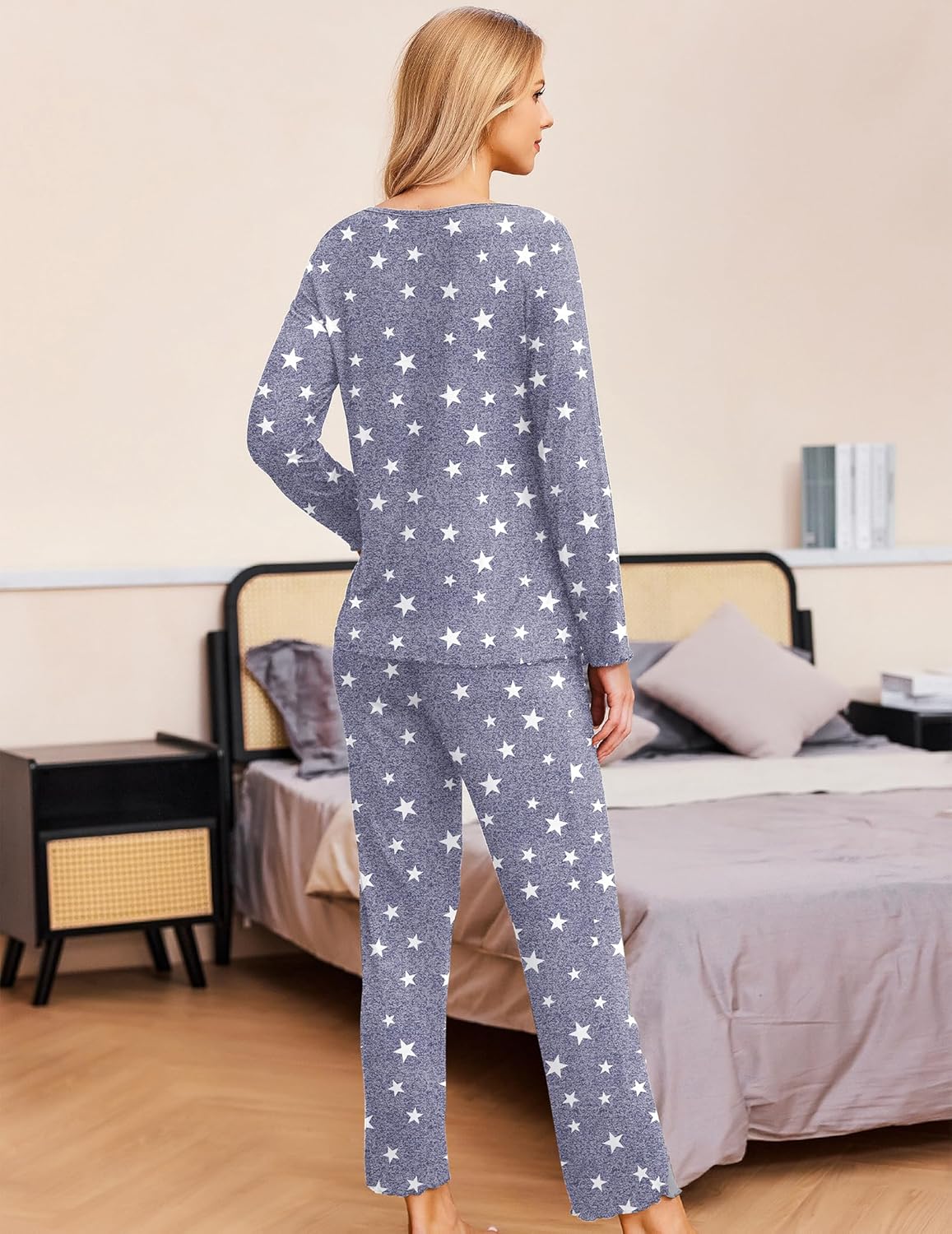 Women’s long-sleeve pajama set with blue base and white star print, full-length pants.