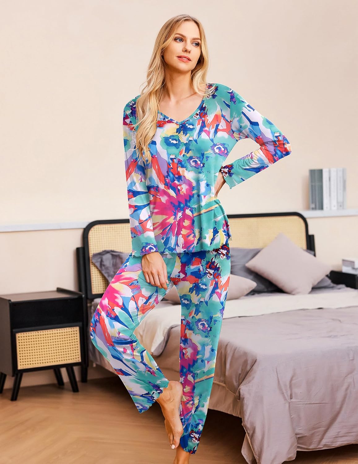 Women’s long-sleeve pajama set with colorful abstract floral print on blue base.