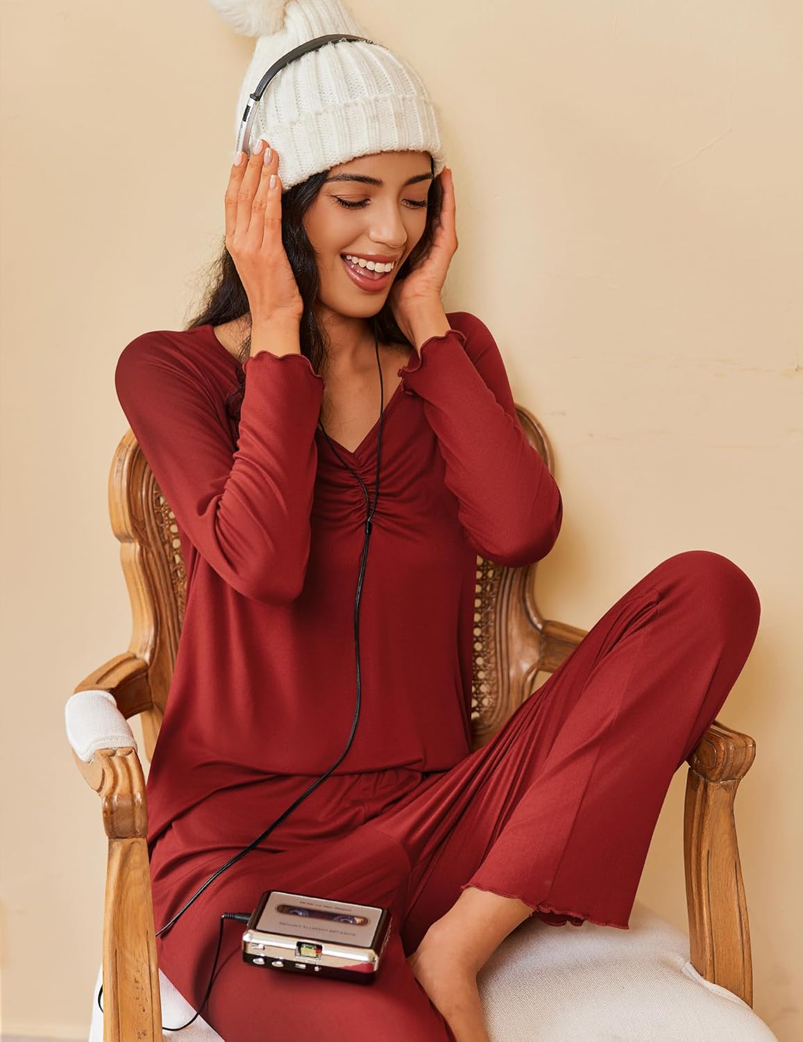 Women’s long-sleeve pajama set in burgundy with zip-front top and flowing pants.
